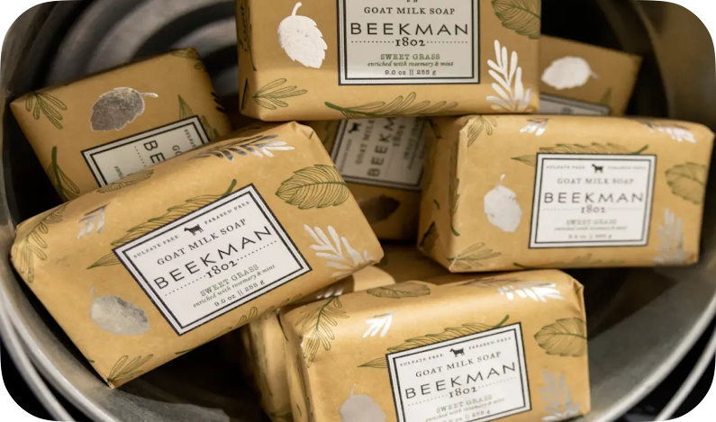 A bucket full of Beekman 1802 bars of soap for sale.