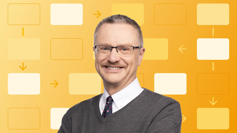 Porträt des lächelnden Professors und Autors Jim Lecinski. Er hat kurze Haare und helle Augen. Er trägt eine Brille sowie einen Pullover über einem Hemd mit Krawatte. Im Hintergrund ist ein System-Workflow zu sehen.